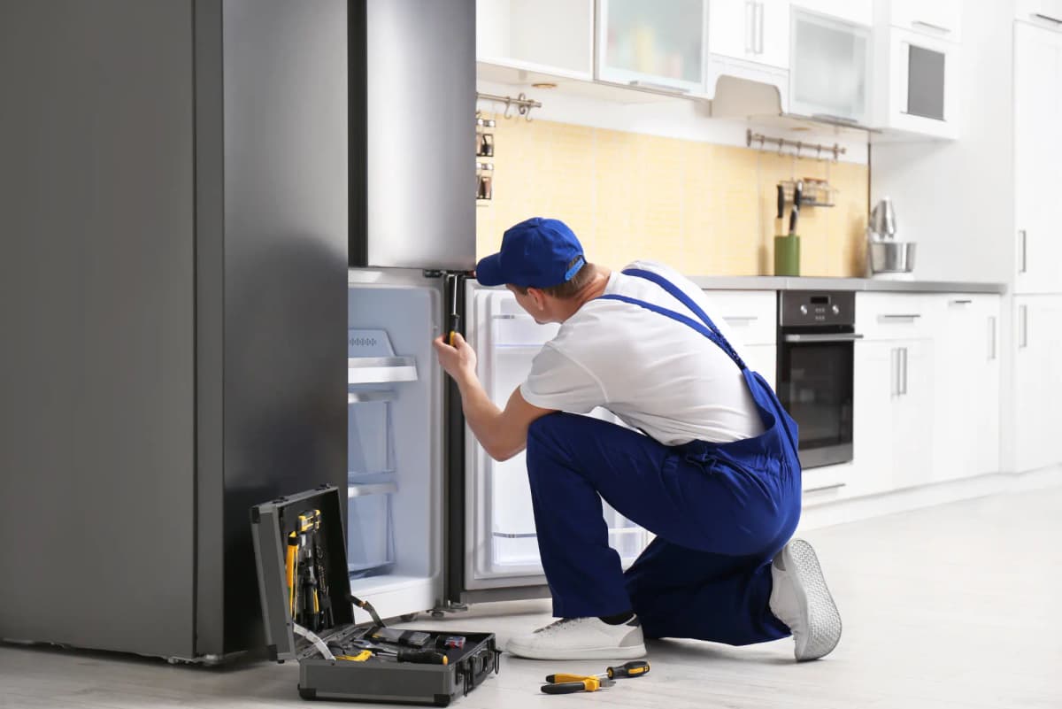 Freezer repair technician at work