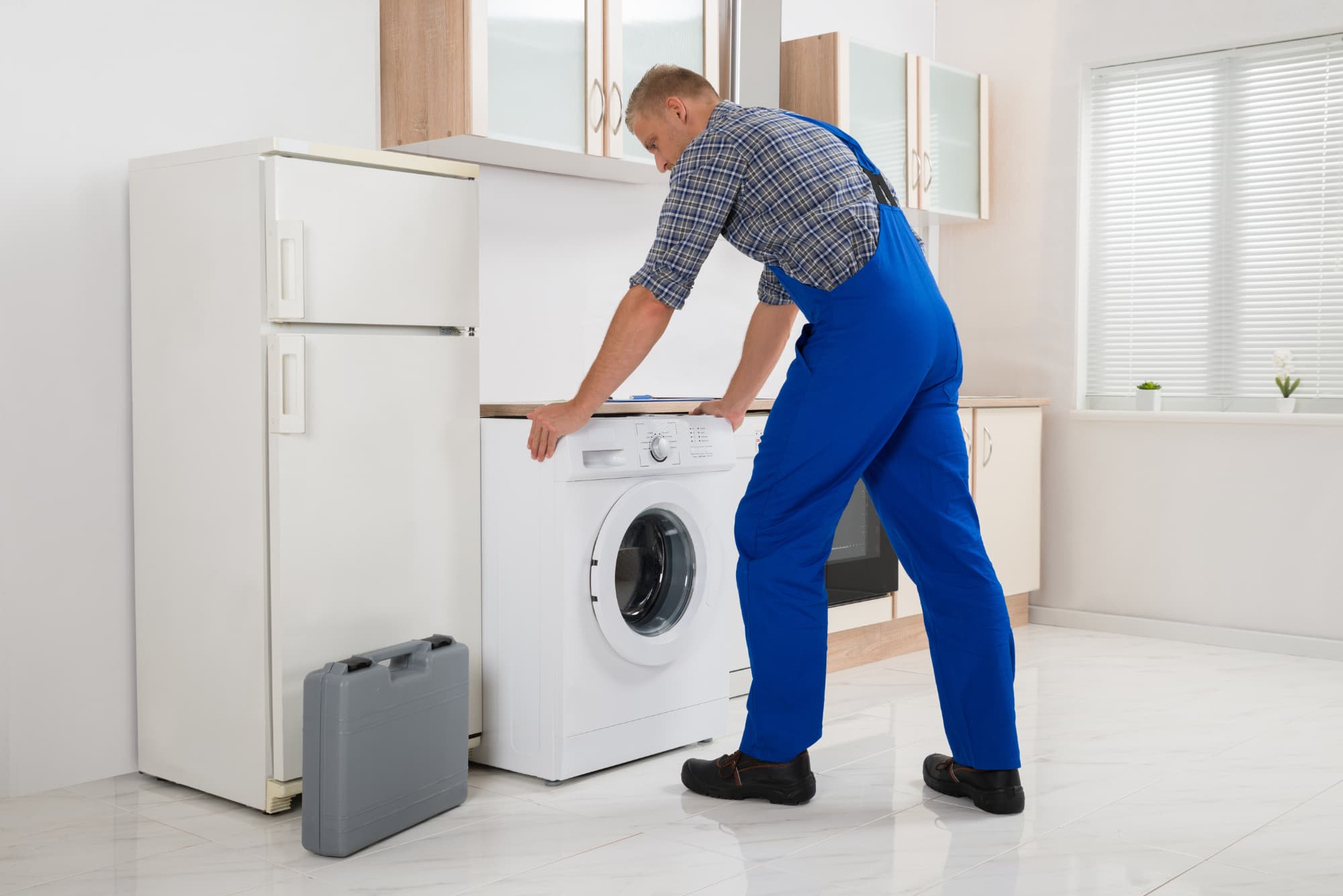 Professional washer technician with toolbox ready to repair your washer
